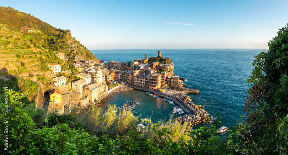 Panorama view of Vernazza and the ocean during sunset at Cinque Terre from above