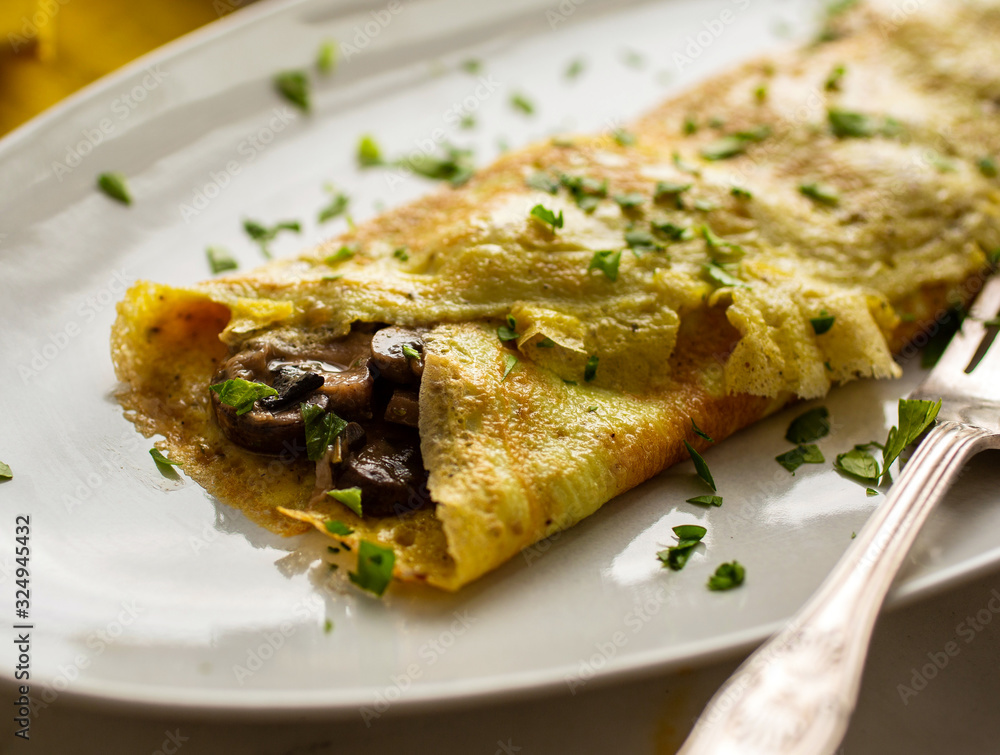 Close up of mushroom ragout omelet served on plate Close up of mushroom ragout omelet served on plate