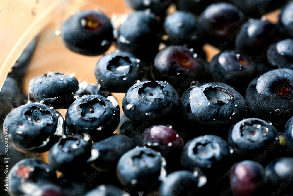 View of blueberries in bowl of water View of blueberries in bowl of water