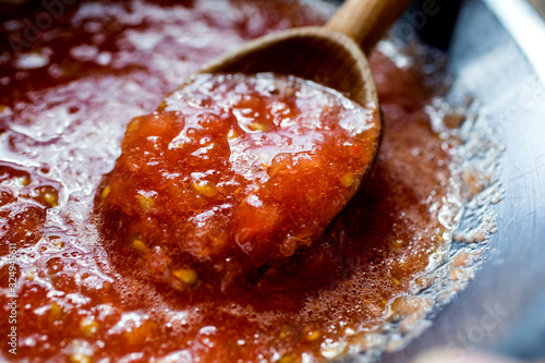 Spicy tomato sauce prepared in wok