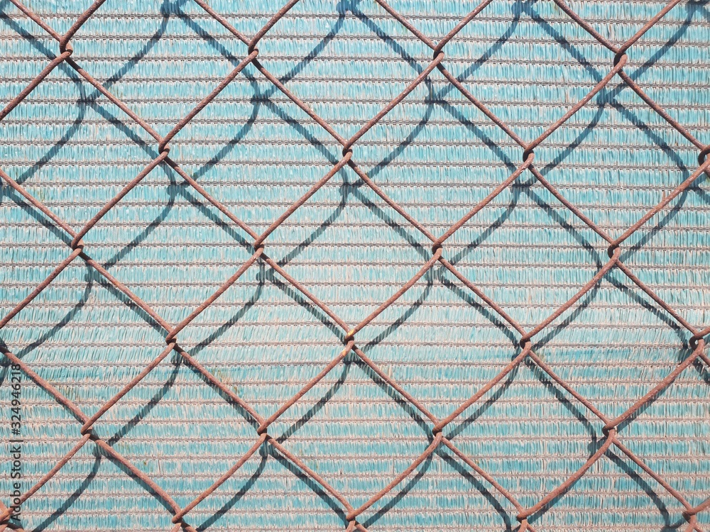 Fototapeta premium chain link fence with barbed wire