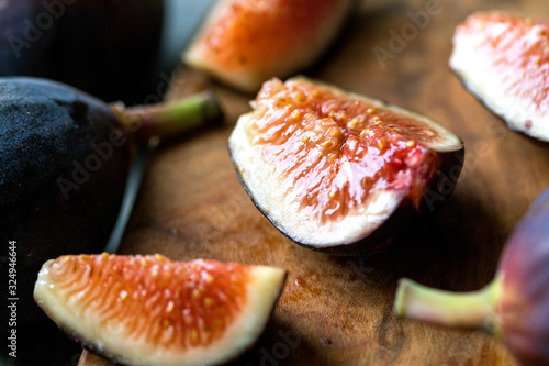 Close up view of sliced fig on wooden board