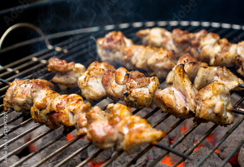 Close up view of barbecued chicken skewers photo