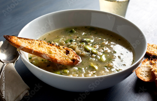 Close up view of barley soup served in bowl