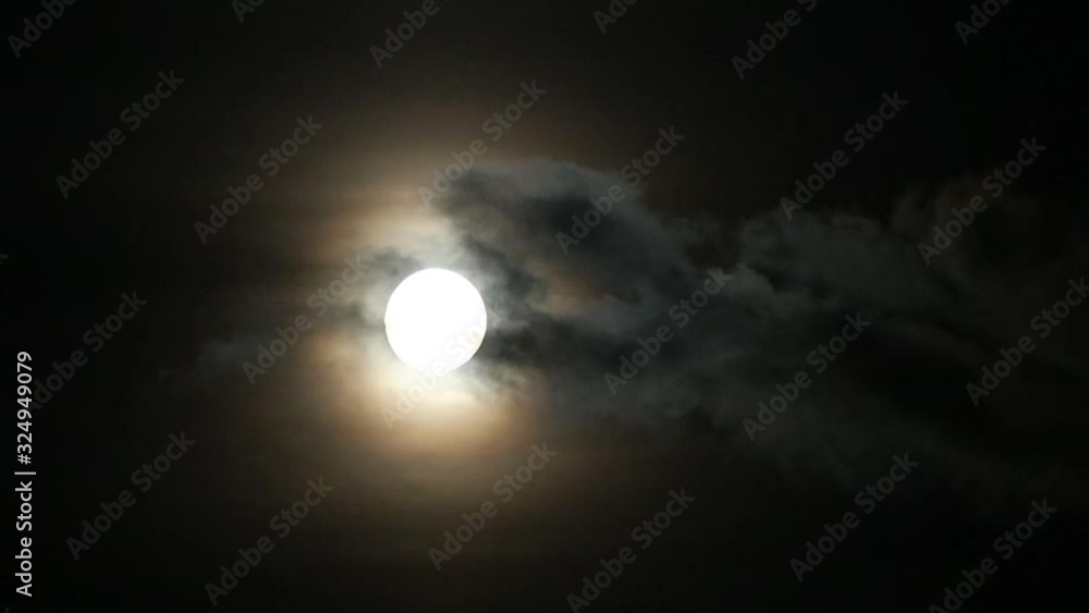 Moon and clouds float fast across the sky Moon and clouds float fast across the sky