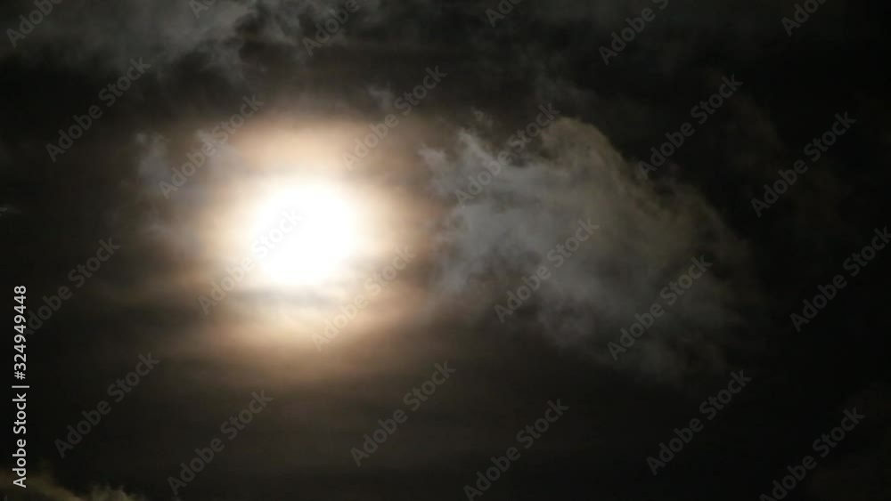 Moon and clouds float fast across the sky Moon and clouds float fast across the sky