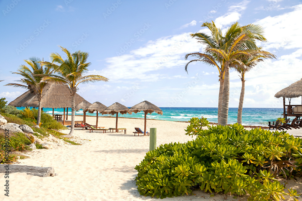 Beautiful sandy beach with turquoise waters in Cozumel Mexico at the Caribbean Sea