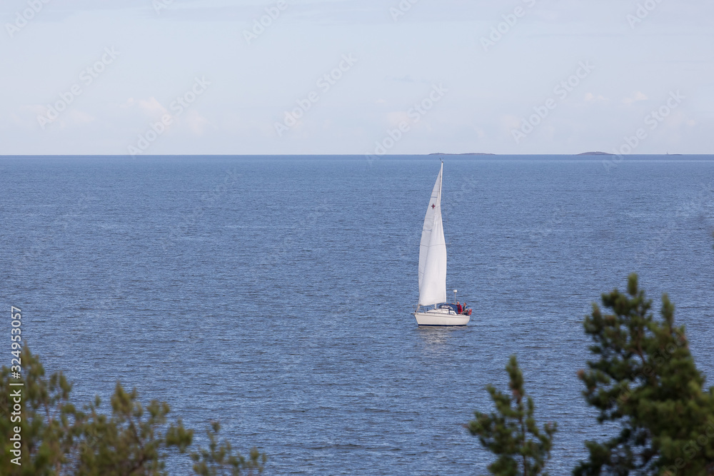 Sailing boats on a Baltic Sea seen from a beach in Sweden