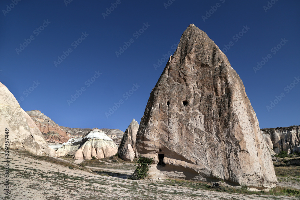 Unusually shaped volcanic rocks in the Pink Valley near the village of Goreme in the Cappadocia region of Turkey.