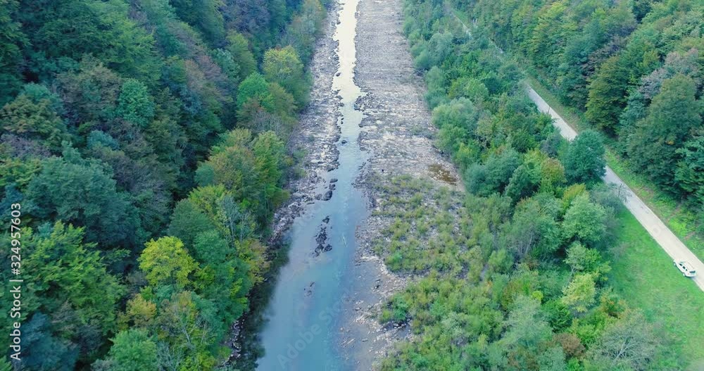 Beautiful scenery of the river surrounded by the dense forest. Kolpa ( Kupa ) river natural border between Slovenia and Croatia. Beautiful scenery of the river surrounded by the dense forest. Kolpa ( Kupa ) river natural border between Slovenia and Croatia.