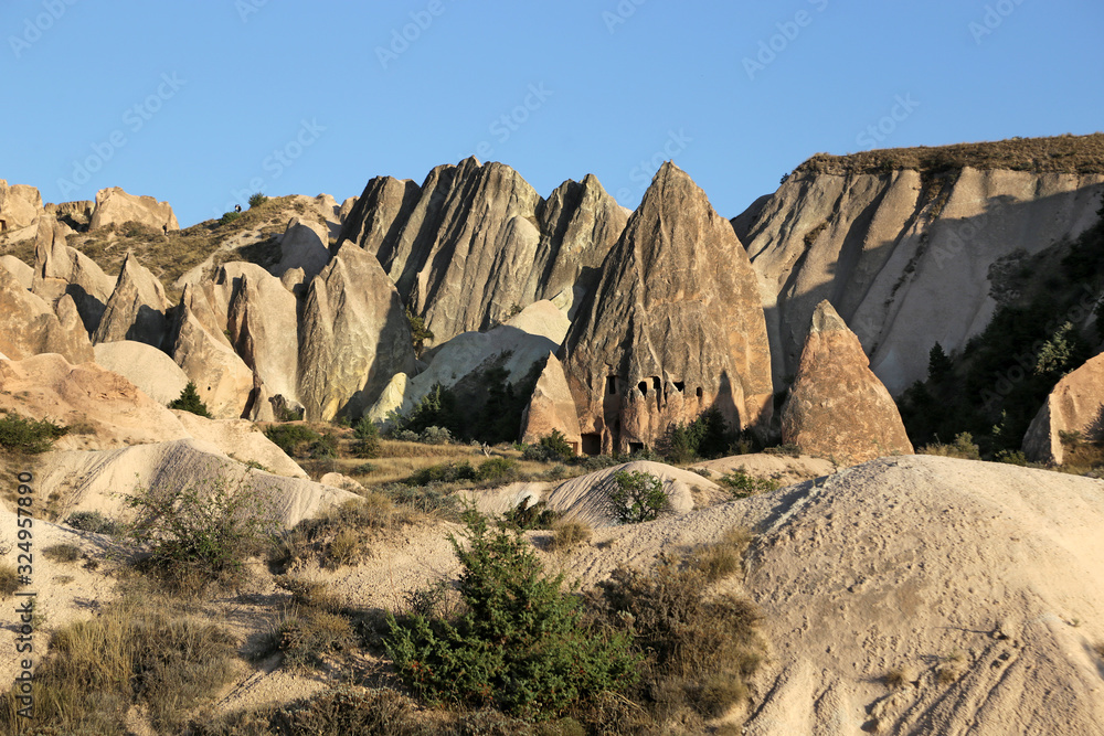 Unusually shaped volcanic rocks in the Pink Valley near the village of Goreme in the Cappadocia region of Turkey.