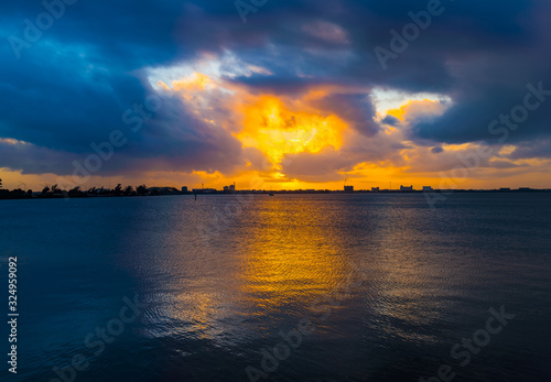 hdr sunset over river with buildings in the horizon