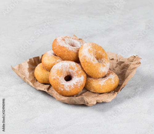 Cottage cheese donuts with milk on a light background