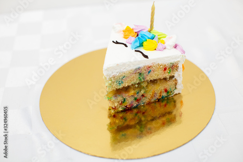 Unicorn themed birthday cake on white background