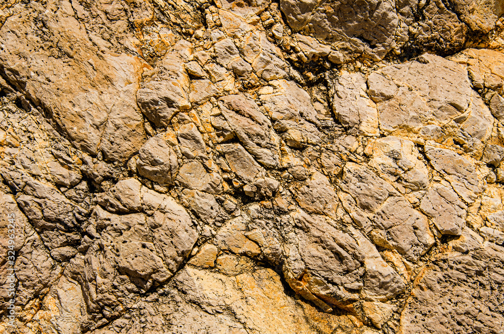 The relief of the rock wall. Mountain background. The relief of the rock wall. Mountain background.