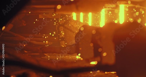Liquid metal in the factory, foundry, smelting iron and processing. Iron and Steel Works. Pouring of molten iron.