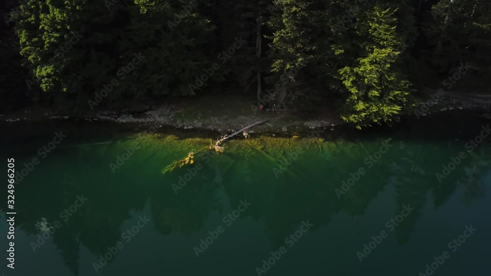 Reflection of Clouds in Glacial Lake Surrounded by a Dense Pine Forest. Zabojsko Lake Reflection. Refleksija Oblaka u Zabojskom Jezeru Okruzenom Borovom Sumom. Reflection of Clouds in Glacial Lake Surrounded by a Dense Pine Forest. Zabojsko Lake Reflection. Refleksija Oblaka u Zabojskom Jezeru Okruzenom Borovom Sumom.