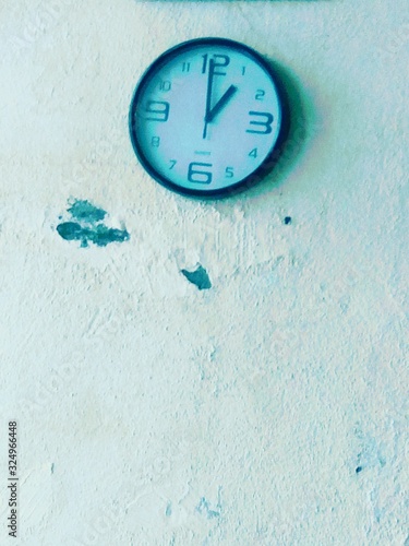 clock on brick wall photo