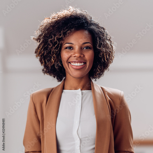 Portrait of young cheerful african american woman photo