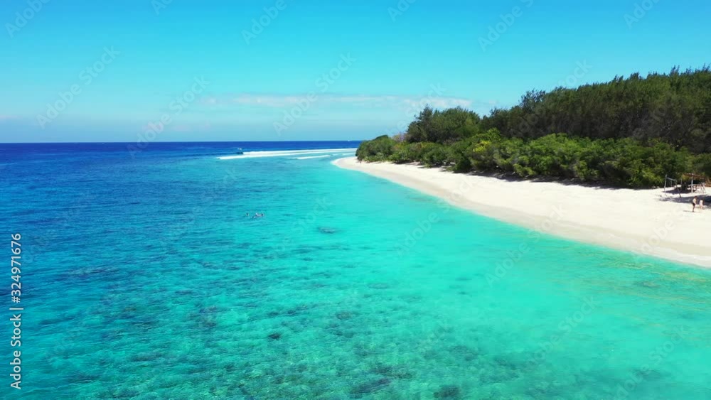 crystal clear turquoise sea water and tropical island with wide white sand beach. Luxury vacation concept, aerial. crystal clear turquoise sea water and tropical island with wide white sand beach. Luxury vacation concept, aerial.