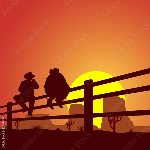 two cowboys are sitting on the fence