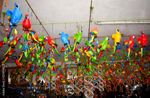 Macaw birds in colors as ceramic ornaments 