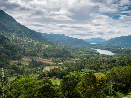 Amazing landscape of valley with jungle forest and lakes between two high mountains on Sri Lanka