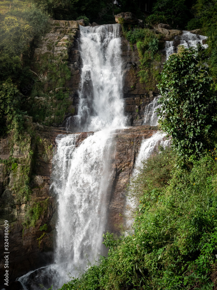 Fototapeta premium Amazing landscape of waterfall cacscade in mountains at tropical jungle forest