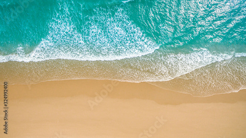 Top view aerial image from drone of an stunning beautiful sea landscape beach with turquoise water with copy space for your text.Beautiful Sand beach with turquoise water,aerial UAV drone shot © kanpisut