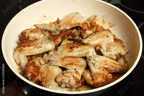 Frying chicken wings