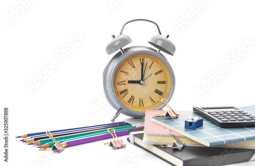 Set of school supplies and clock on white background. Time to study