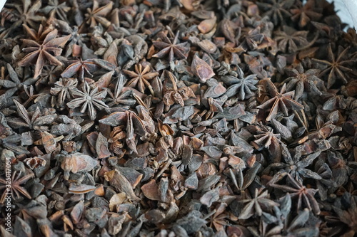 Common name Chinese star anise, Star anise, Star aniseed, Badiane (France), Badian (Arabic), Badian khatai (India), Bunga lawang (Malaysia, Indonesia) photo