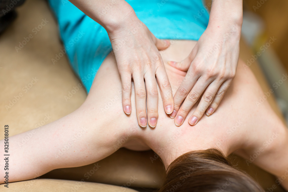 Young woman and back massage in spa Young woman and back massage in spa