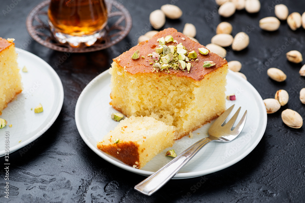Revani - sweet semolina cake with pistachio, traditional turkish dessert Revani - sweet semolina cake with pistachio, traditional turkish dessert