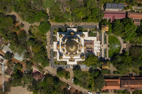 Top down aerial view of Buu Long Pagoda, a beautiful Buddhist temple with large gold roof structure in Saigon, Ho Chi Minh City, Vietnam photo