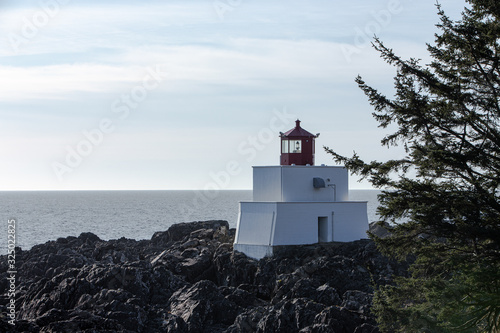 Amphitrite Point Lightstation (Ucluelet), a tower with a light that gives warning of shoals to passing ships. Vancouver Island, Canada photo