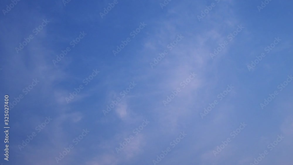 A blue sky with beautiful wisp of cloud for use as a backing or backdrop. A blue sky with beautiful wisp of cloud for use as a backing or backdrop.