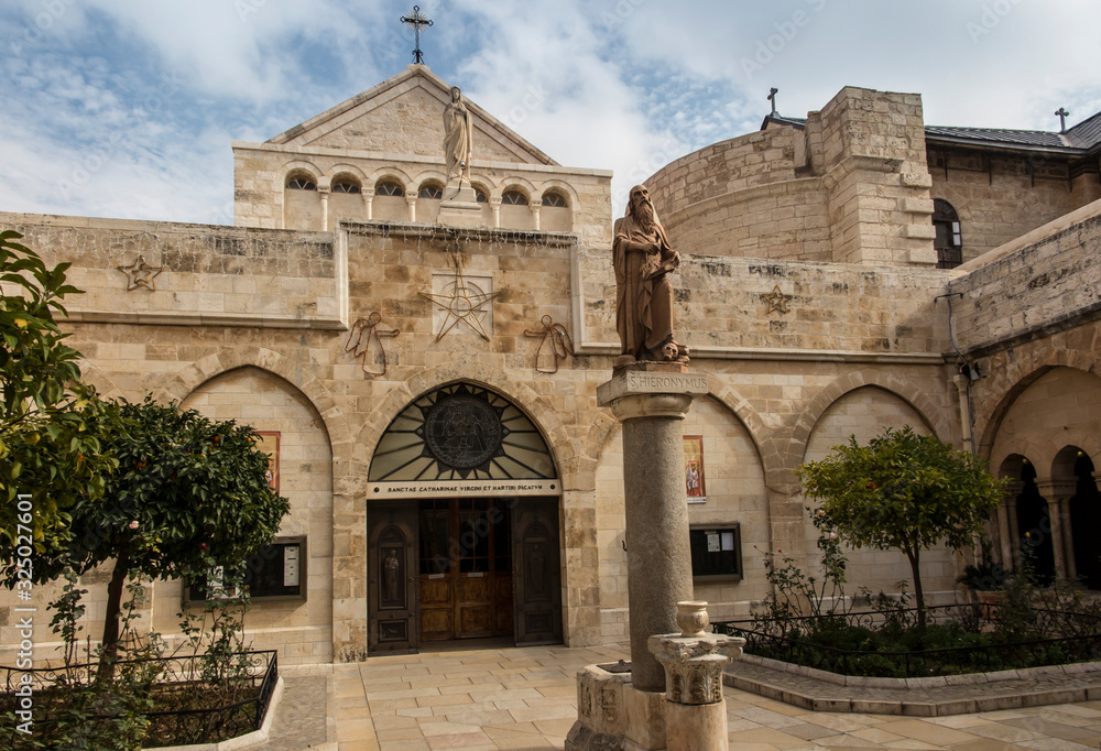 City of Bethlehem. The church Catherine next to the Basilica of the Nativity of Jesus Christ. Column with the figure of Saint Jerome