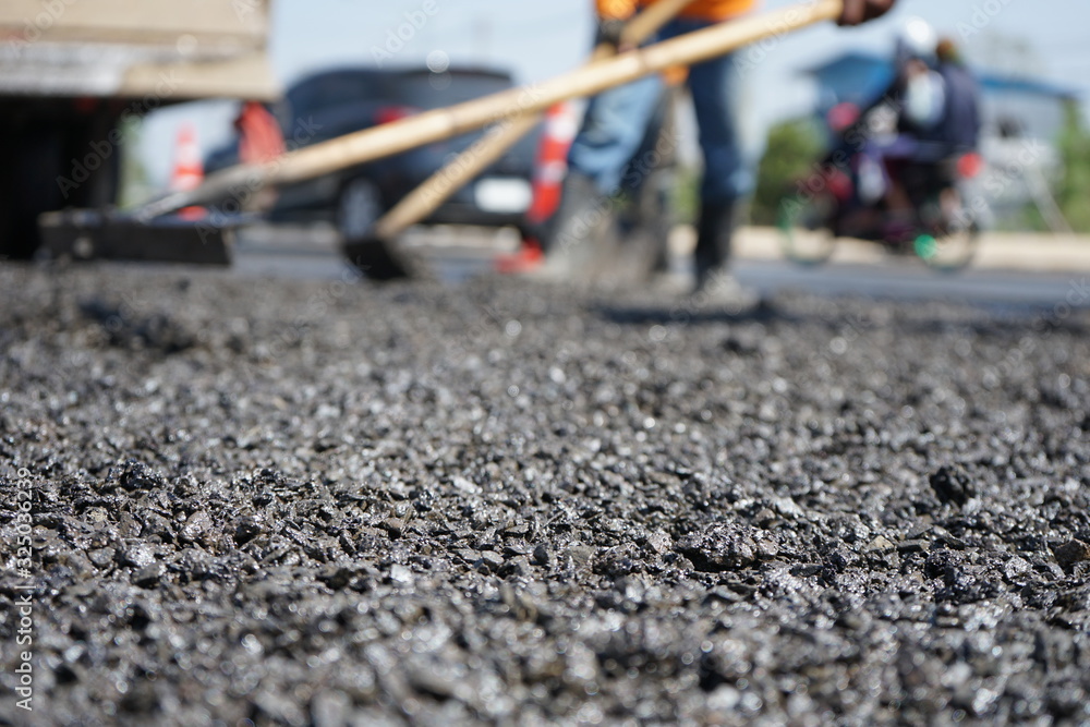 Blur image, repairing pavement mainly by manual labor Blur image, repairing pavement mainly by manual labor