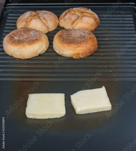 Haloumi cheese squares and burger bans on grill