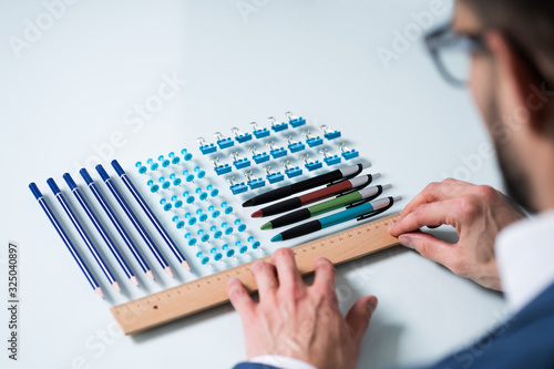 Person Arranging The Clips With Scale