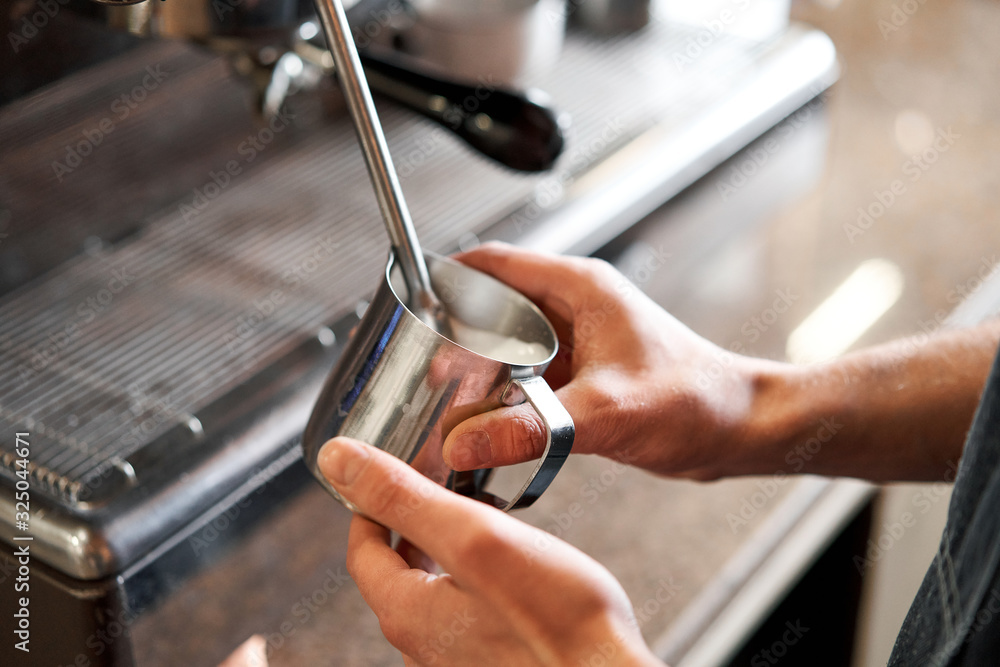 small business, people and service concept. Bartender in apron with holder and tamper preparing coffee at coffee shop small business, people and service concept. Bartender in apron with holder and tamper preparing coffee at coffee shop