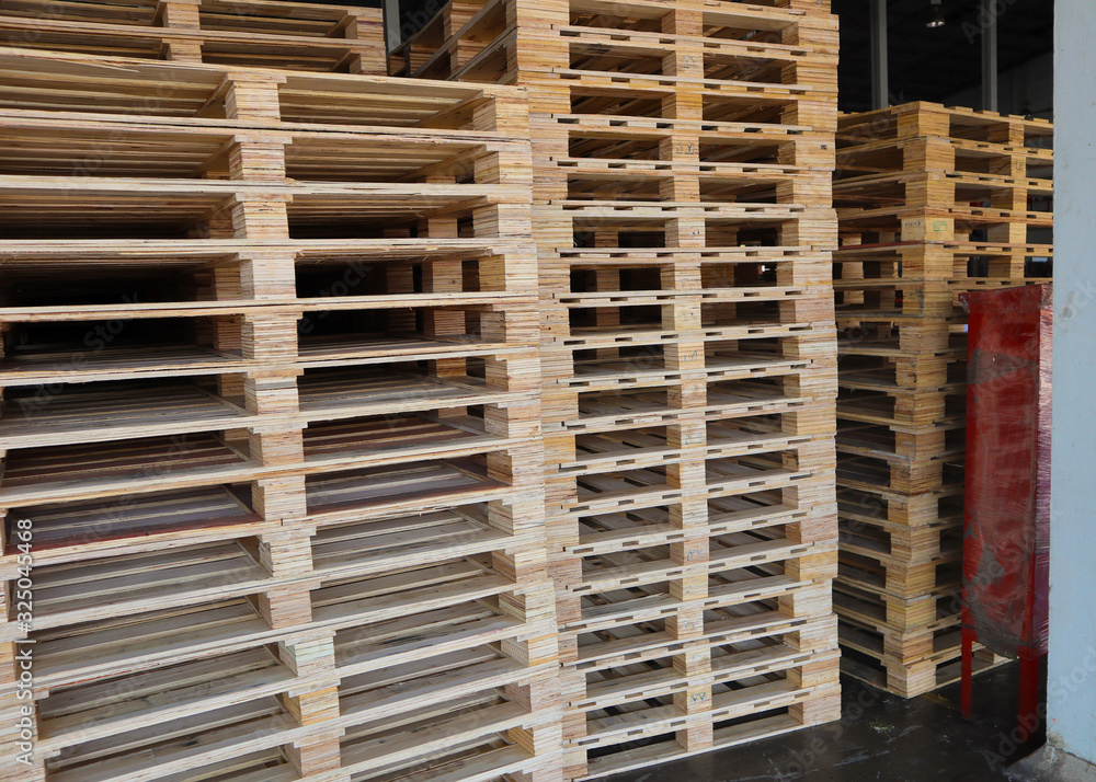 Wooden pallets stack at the freight cargo warehouse for transportation and logistics industrial, Driver forklift loading, Wooden pallets stack at the freight cargo warehouse for transportation and logistics industrial, Driver forklift loading,