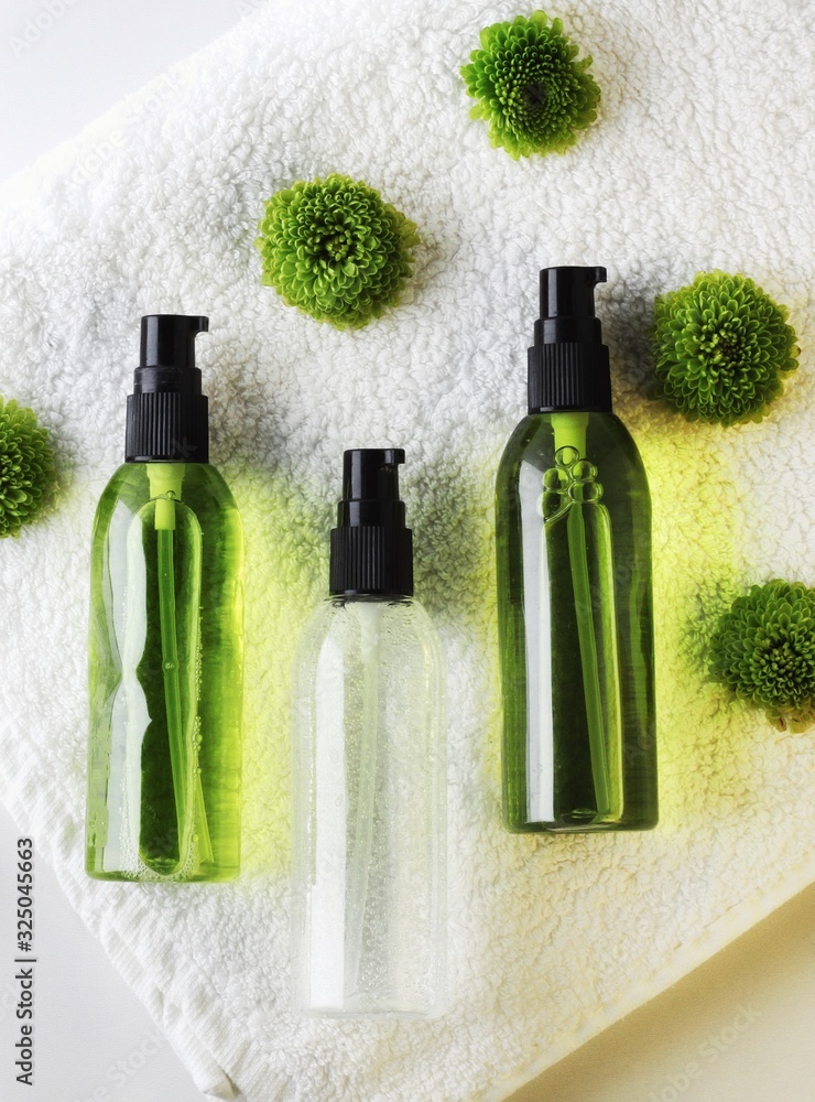 Organic skincare products on minimalistic SPA background with copy space