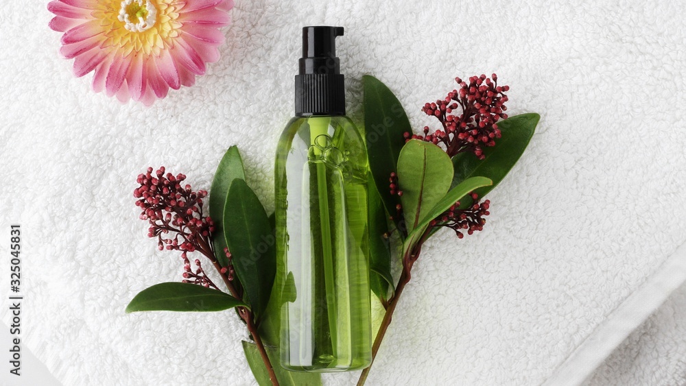 Organic skincare products on minimalistic SPA background with copy space