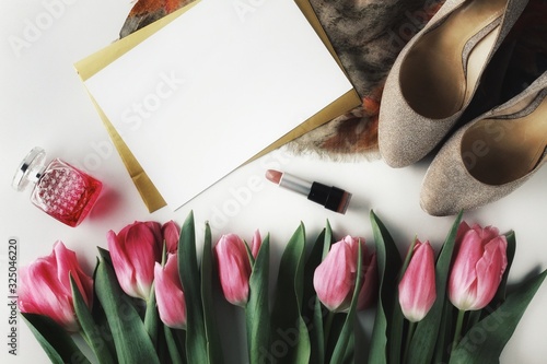 Obraz na płótnie Beautiful spring flowers bouquet with cosmetics for greetings isolated on white w salonie