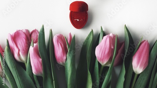 Obraz na płótnie Beautiful spring flowers bouquet with cosmetics for greetings isolated on white w salonie