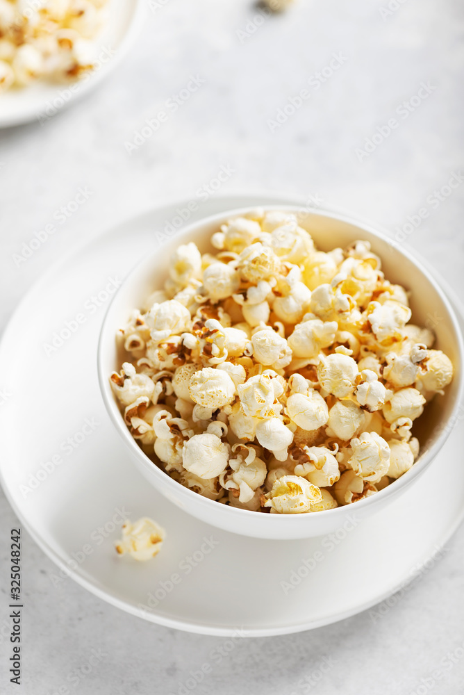 Salt popcorn in the light bowl Salt popcorn in the light bowl