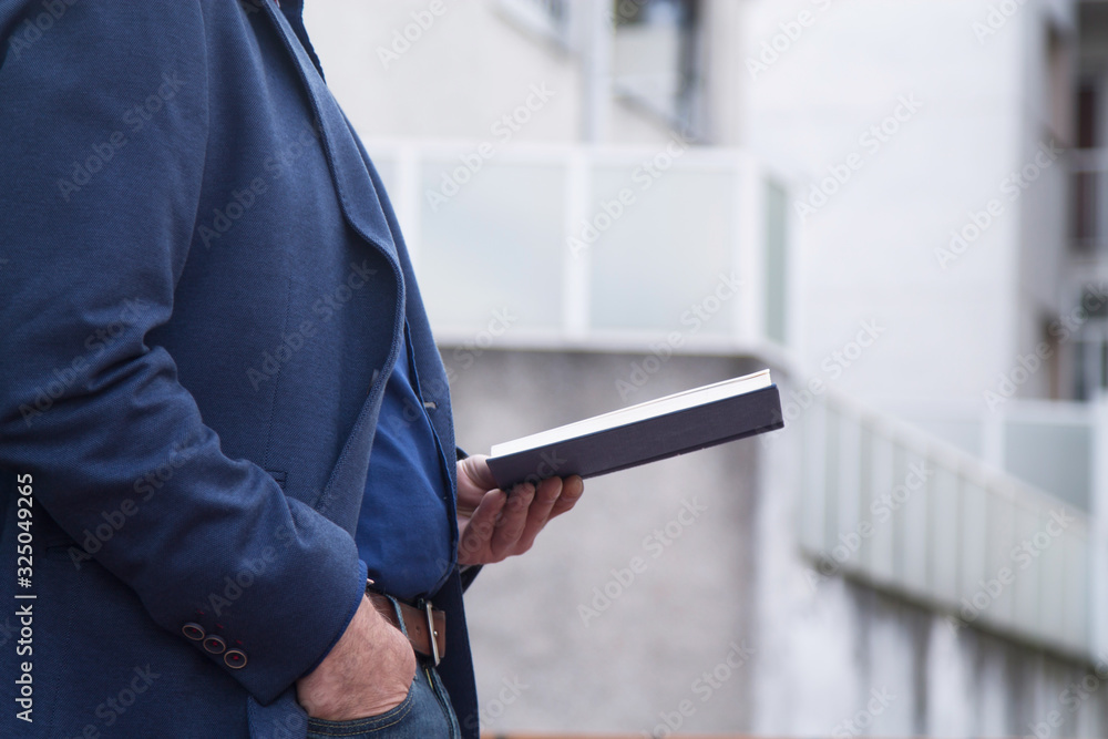 businessman reading a book on background businessman reading a book on background