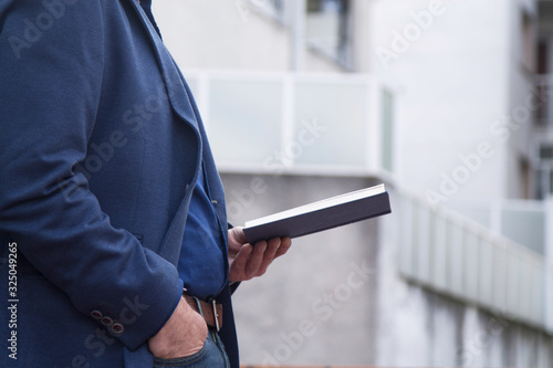 businessman reading a book on background